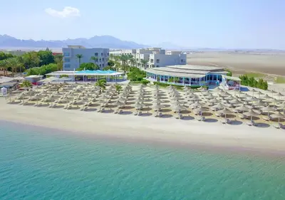 an aerial view of a beach with chairs and umbrellas at JAZ Soma Beach in Hurghada