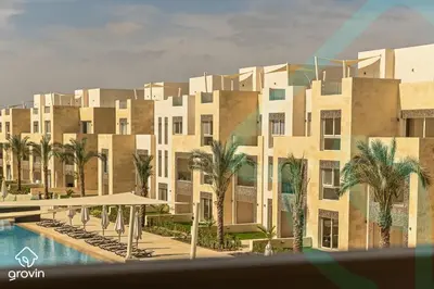 a rendering of a building with a pool and palm trees at Mangroovy Residence El Gouna - Grovin in Hurghada