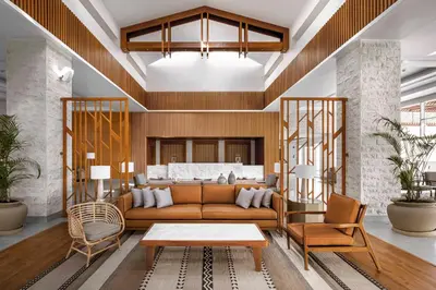 a living room with a brown couch and chairs at JAZ Costa Mares- Adults Friendly 16 Years Plus in Marsa Alam City