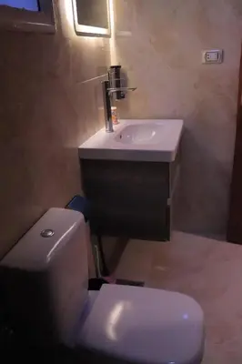 a bathroom with a white sink and a toilet at Studio Lotus compound near Touristic Mamsha in Hurghada