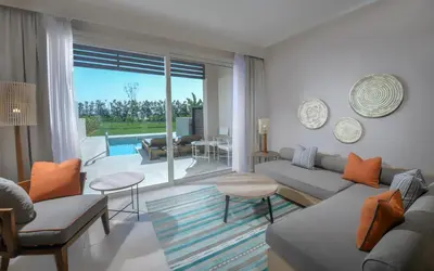 a living room with a couch and a table at Steigenberger Resort Ras Soma in Hurghada