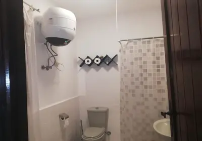 a small bathroom with a toilet and a sink at Chalet at Stella Makadi Beach in Hurghada