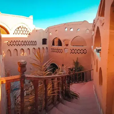 a courtyard of a building with a fence at Scorpion House Luxor in Luxor