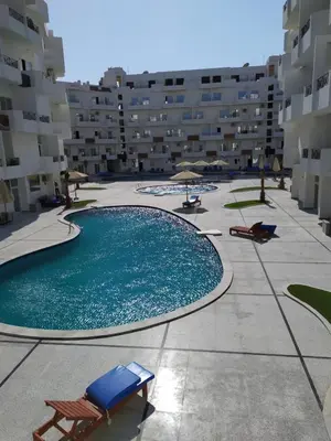 a swimming pool in the middle of a building at Studio beside El Gouna with good kite spot in 500 m in Hurghada