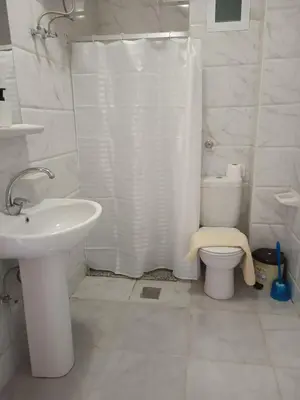 a bathroom with a toilet and a shower and a sink at Studio beside El Gouna with good kite spot in 500 m in Hurghada