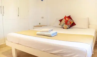 a white bed with two towels on top of it at El Gouna 1 bedroom apartment in West Golf Y12 in Hurghada
