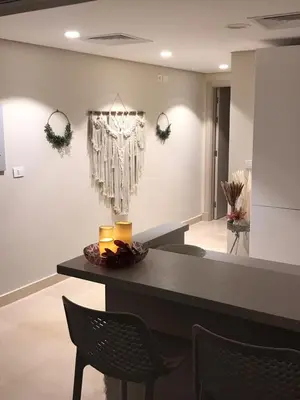 a dining room with a table and chairs at Jutta Deluxe 2-Bedroom-Apartment Mangroovy-M7 El Gouna in Hurghada