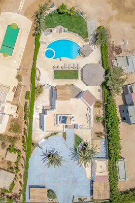 an aerial view of a mansion with a swimming pool at 4 Bedroom Villa with Heated Pool, Jacuzzi & Lagoon View in Phase 4 in Hurghada