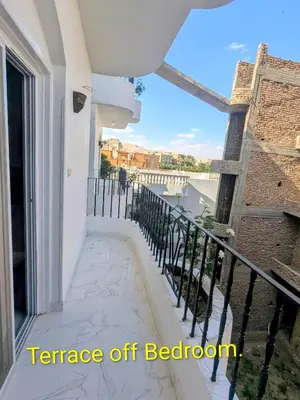a balcony with a view of a river at Al Ramla Guest House in Luxor