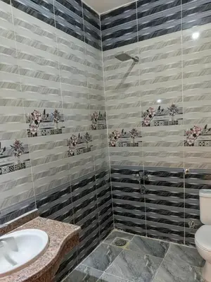 a bathroom with a toilet and a sink at Al Ramla Guest House in Luxor