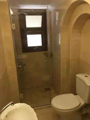 a bathroom with a toilet and a shower at Charming Lagoon Villa with pool Egyptian Style -Sabina 117 in Hurghada