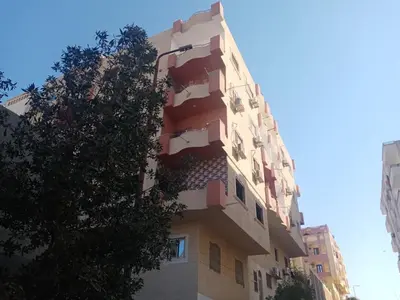 a tall building with balconies on the side of it at Rhein in Hurghada