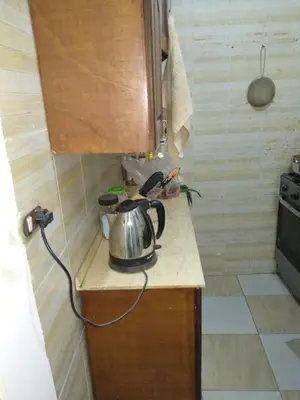 a tea kettle on a counter in a kitchen at Bob Marley Homestay in Hurghada