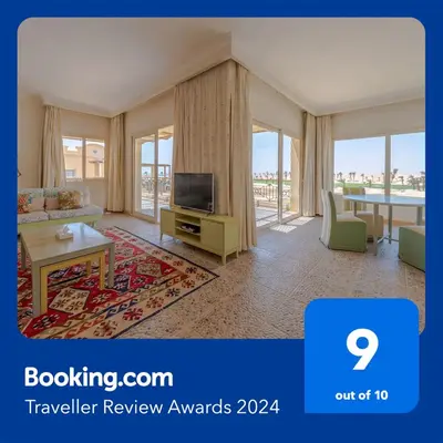 a living room with a television and a table at VESTA - Soma Bay Residence in Hurghada