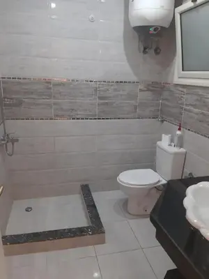 a bathroom with a toilet and a sink at apartman Marek in Hurghada