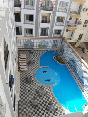 an overhead view of a swimming pool in a building at apartman Marek in Hurghada