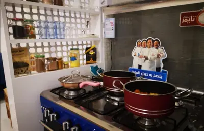 a kitchen with two pots and pans on a stove at Sinderella Private Pool Villa in Luxor