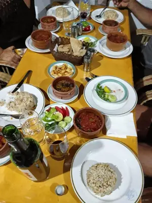 a table topped with plates of food and bowls of food at Dara guest House in Aswan