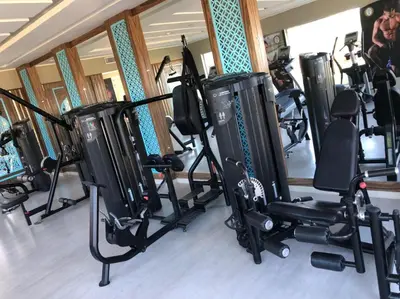 a gym with a bunch of treadmills and ellipticals at Lazuli Hotel, Marsa Alam in Quseir