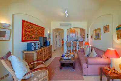 a living room with a couch and a table at VESTA - El Gouna Residence in Hurghada