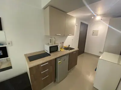 a small kitchen with a sink and a microwave at G cribs B1F2 in Hurghada