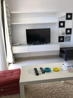 a living room with a tv and a coffee table at G cribs B1F2 in Hurghada