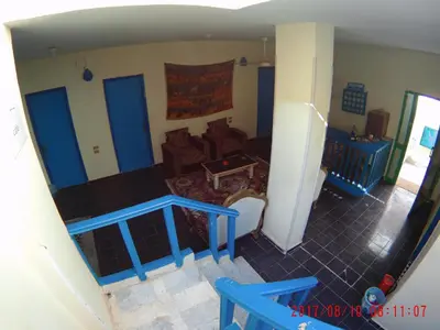 an aerial view of a living room with blue doors at Sea Waves Hostel not for Egyptian in Hurghada
