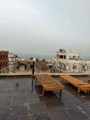 a group of benches sitting on top of a roof at The LOTUS in Hurghada