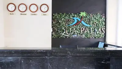 a sign for the qatar palms hotel at Aqua Palms Studio A210 in Hurghada
