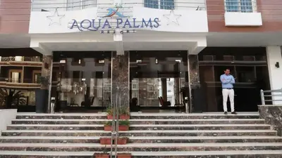 a man standing in the doorway of a building at Aqua Palms Studio A210 in Hurghada
