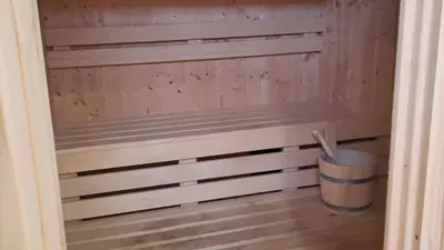 a closet with wooden paneling and a trash can at Aqua Palms Studio A210 in Hurghada