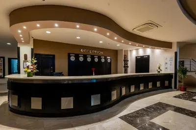 a lobby with a hair salon with a bar at El Karma Beach Resort & Aqua Park - Hurghada in Hurghada