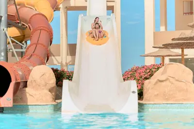 a slide in the water at a resort at El Karma Beach Resort & Aqua Park - Hurghada in Hurghada