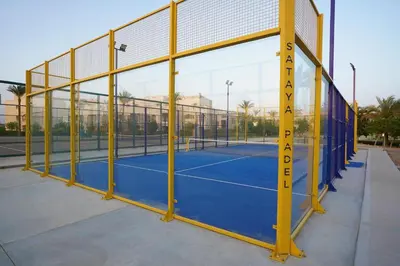 a tennis court with a tape measure on it at Sataya Resort Marsa Alam in Marsa Alam City