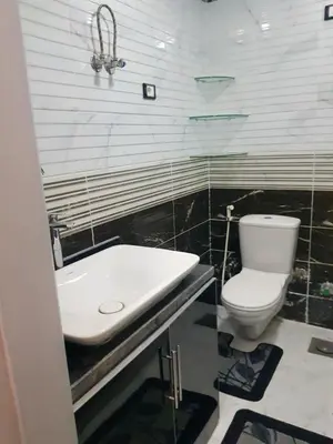 a bathroom with a toilet and a sink at Chalet stella makadi family only in Hurghada