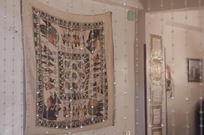 a large tapestry hanging on a wall at SWEET HOSTEL LUXOR in Luxor
