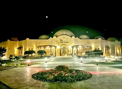 a large building at night with lights in front at FabbricaCasa Sea Front Villa, Oriental Coast in Marsa Alam City