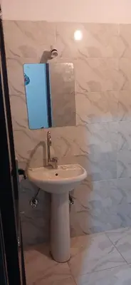 a bathroom with a sink and a mirror at Masa Nubian House in Aswan
