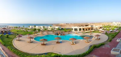 an overhead view of a swimming pool with umbrellas at New Eagles Aqua Park Resort in Hurghada