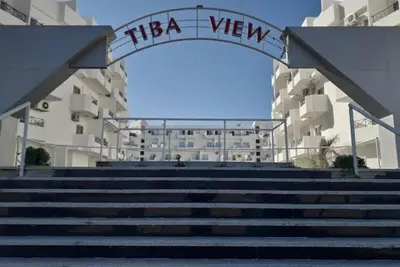 a set of stairs leading to a building with a sign at Tiba View - Unit no B15 - near ElGouna in Hurghada
