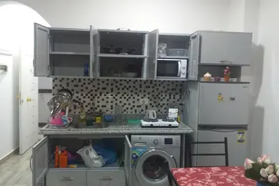 a kitchen with a washing machine in a kitchen at 201Sheraton Plaza in Hurghada