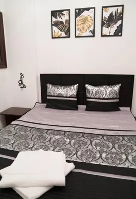 a bedroom with a large bed with two pillows at Turtles Beach Resort - Sea View in Hurghada