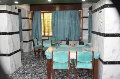 a row of tables and chairs in a room at Tiba Hotel in Aswan