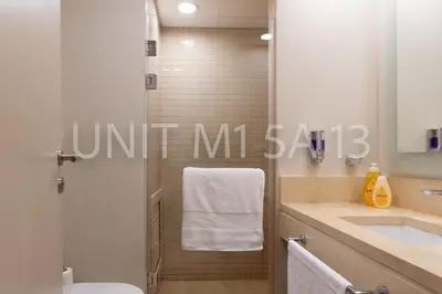 a bathroom with a shower and a toilet and a sink at Elgouna Heart Mangroovy new 2bedrooms in Hurghada