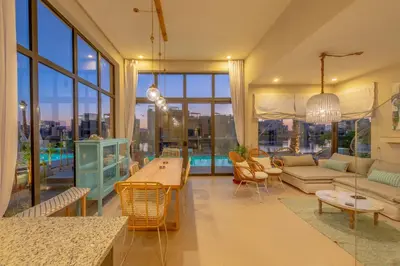 a living room with a couch and a table at La Casa de Playa Tawila on Island 4BR Private with Heated Pool in Hurghada