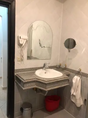 a bathroom with a sink and a mirror at سهل حشيش in Hurghada