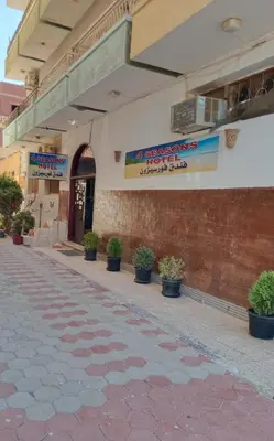 a building with potted plants on the side of it at Four Seasons Hotel in Hurghada