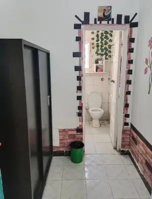a bathroom with a toilet in a room at Four Seasons Hotel in Hurghada
