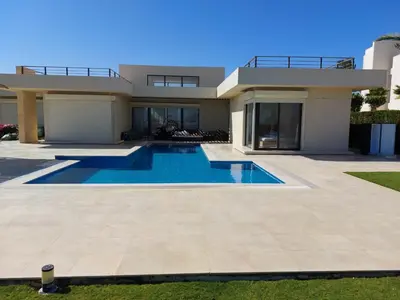 a house with a swimming pool in front of it at El Gouna luxe in Hurghada