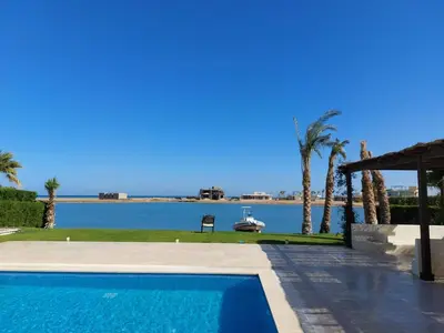 a swimming pool with a view of the water at El Gouna luxe in Hurghada